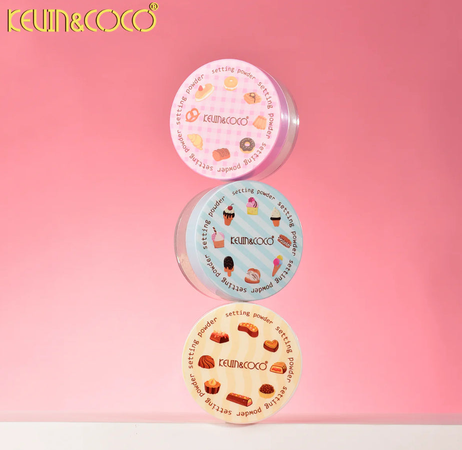 Three round containers of KEVIN&COCO setting powder on a pink background