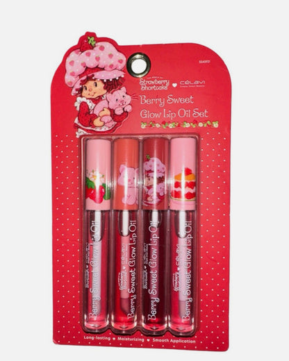 Set of berry sweet lip oils in packaging with Strawberry Shortcake design