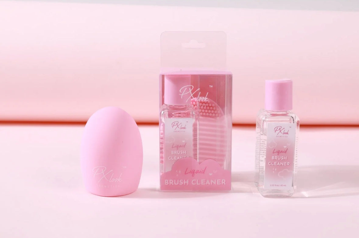 Pink makeup brush cleaner with packaging on a pink background