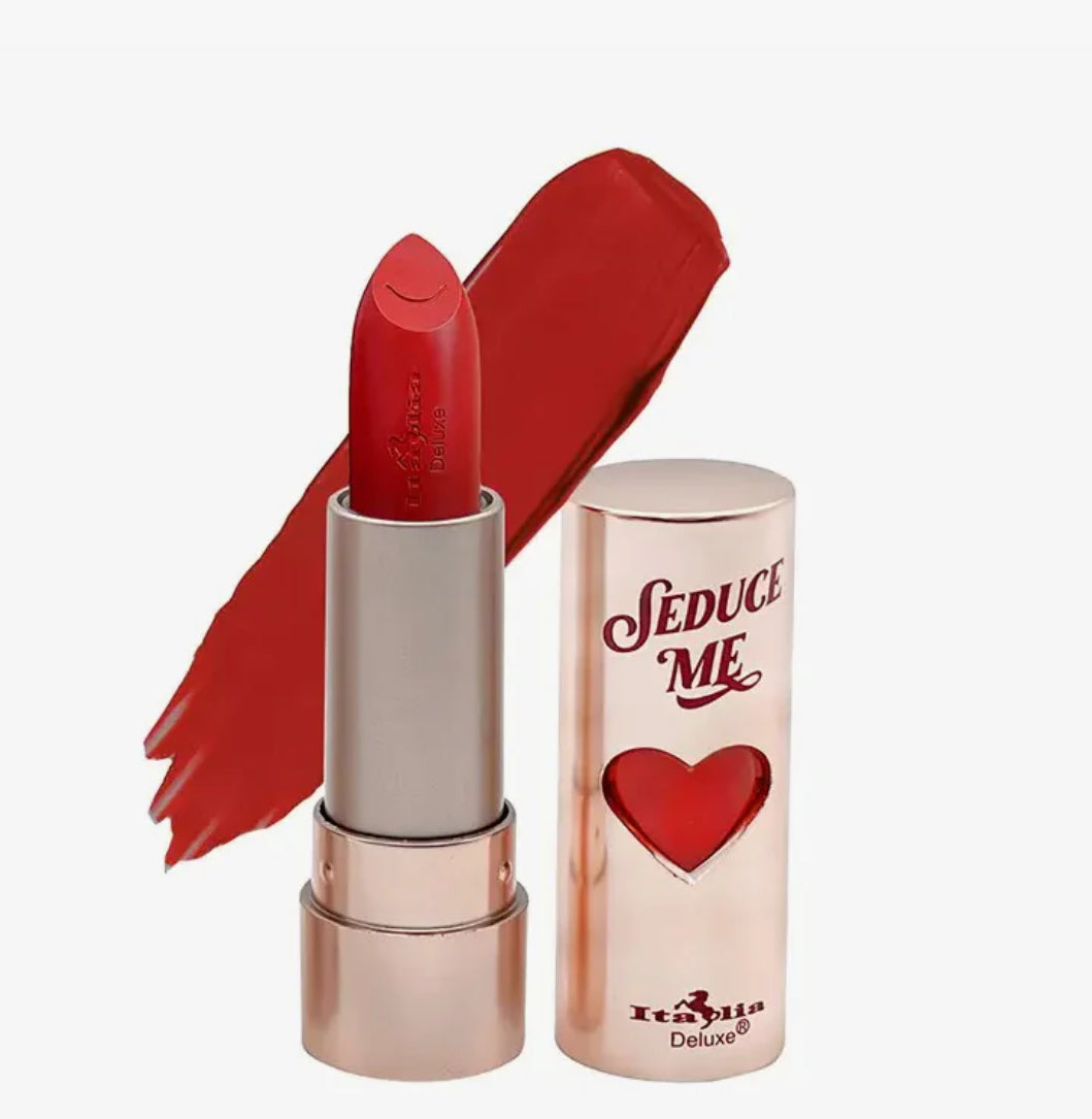 Red lipstick with rose gold casing and 'Seduce Me' packaging on a white background