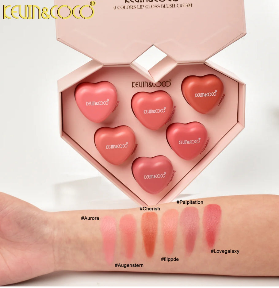 Heart-shaped lip and cheek color set with swatches on a arm against a white background