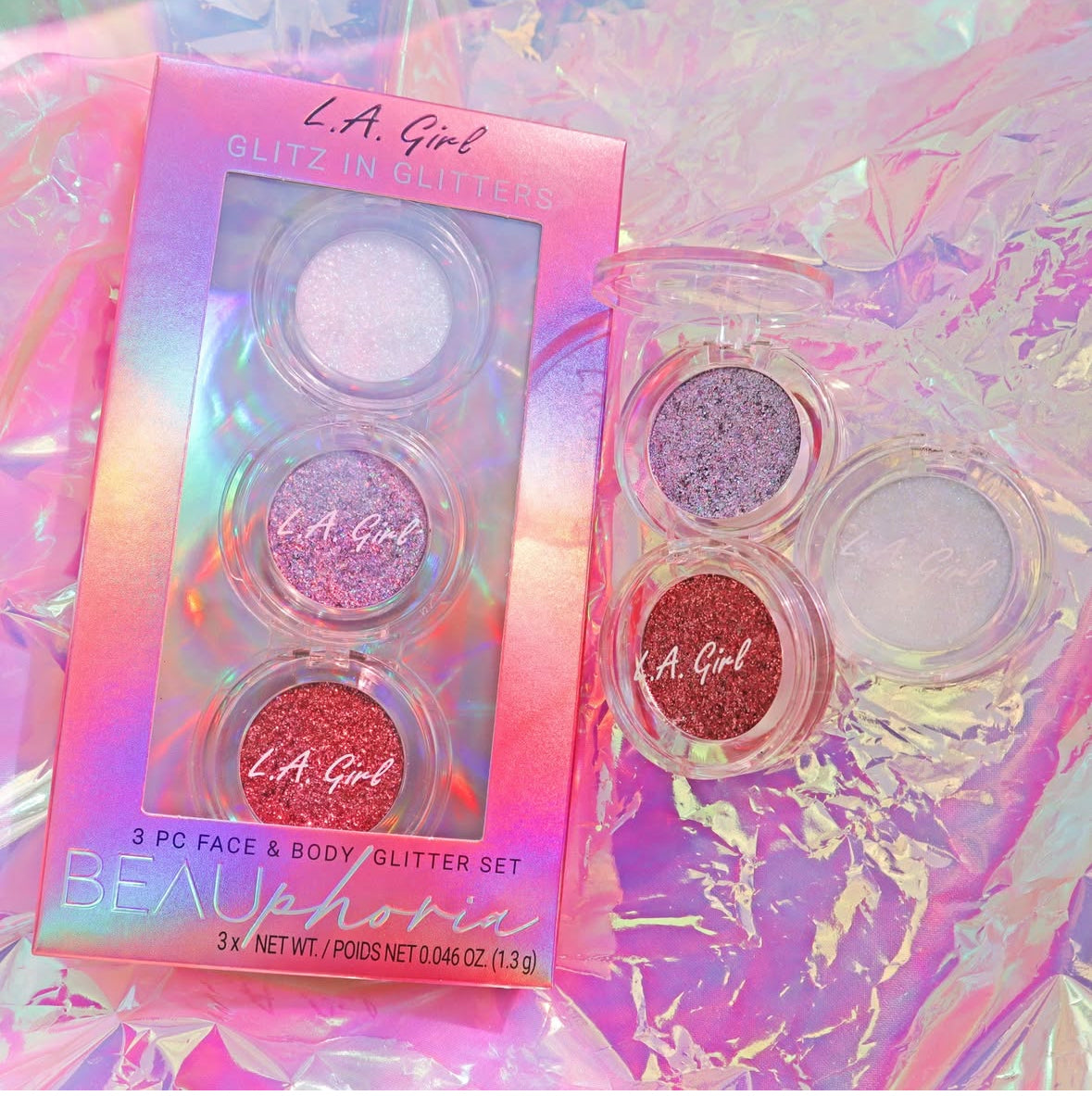 L.A. Girl glitter set with packaging on a colorful background