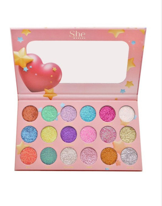 Colorful eyeshadow palette with 'She' branding on a white background