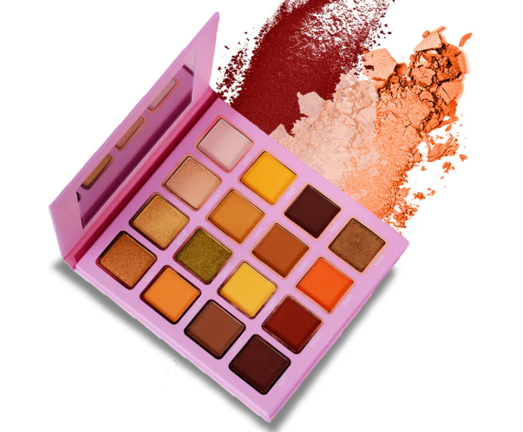 Makeup palette with various colors and a pink case on a white background